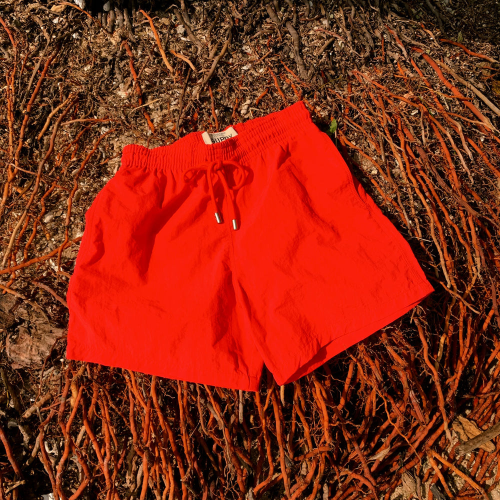 
                      
                        Clay Core Swim Shorts
                      
                    